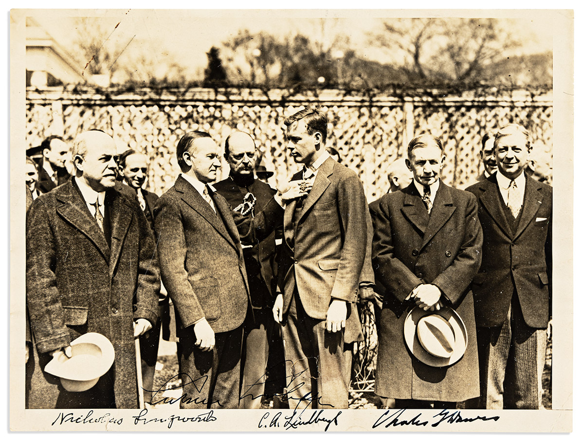 (AVIATORS.) LINDBERGH, CHARLES A.; AND CALVIN COOLIDGE. Photograph Signed, by both (C.A. Lindbergh and Calvin Coolidge), half-lengt